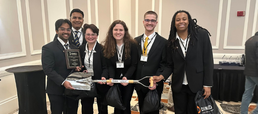 Drexel construction managment students gather and pose after winning prize